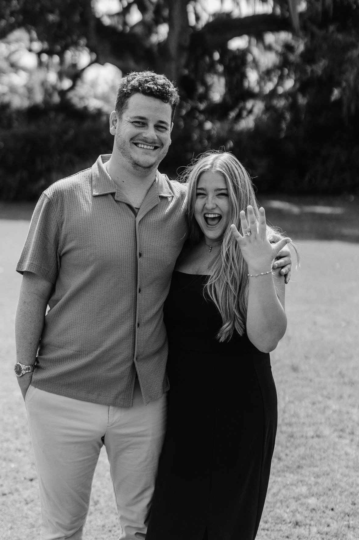 Megan and Spencer, just engaged, showing the ring